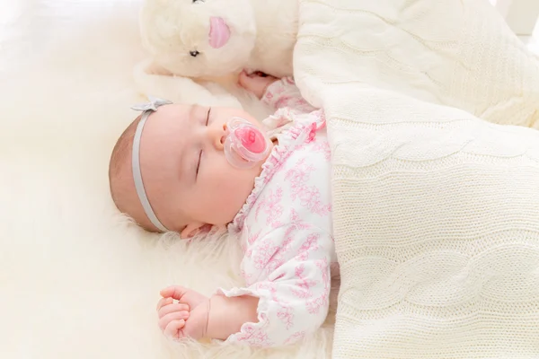 Baby girl laying on her blanket Stock Photo