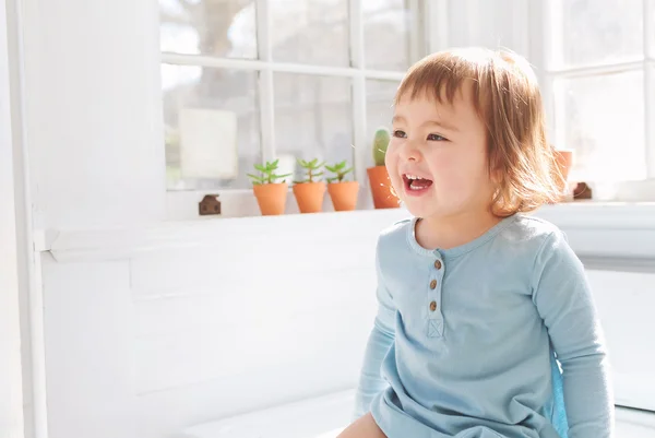 Happy toddler smiling in her house — Stock Photo, Image