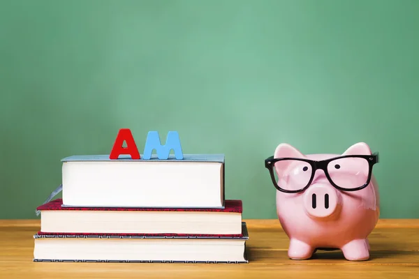 Master of Arts Degree theme with piggy bank — Stock Photo, Image