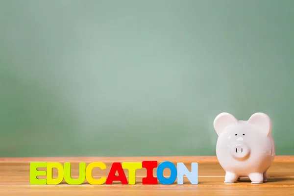 Education theme with piggy bank — Stock Photo, Image