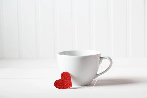 Coffee cup with small heart — Stock Photo, Image