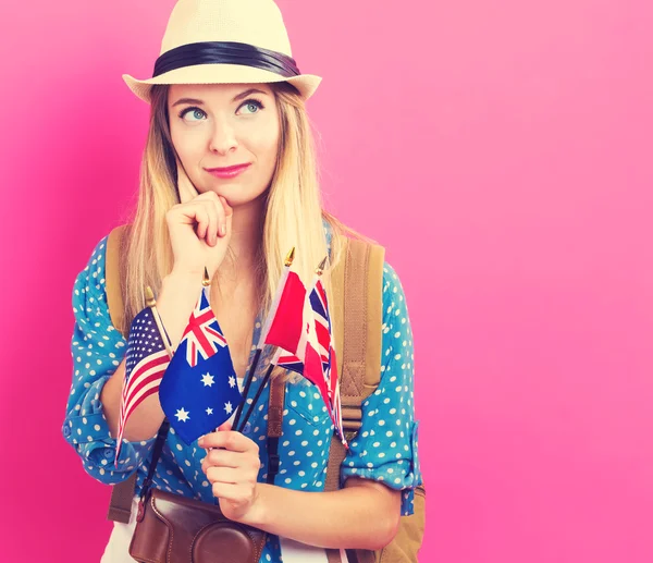Kvinna med flaggor i engelsktalande länder — Stockfoto