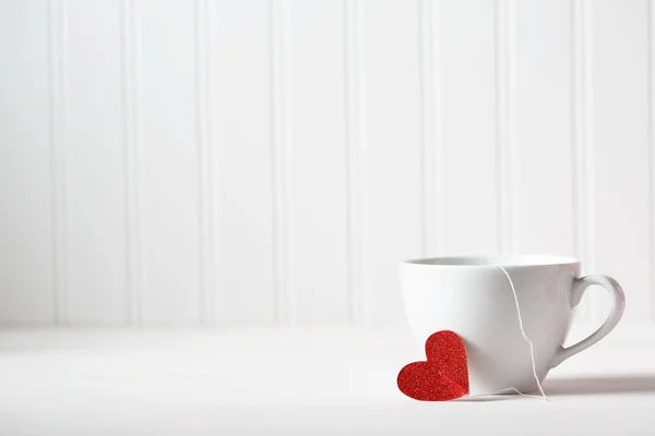 Coffee cup with small heart — Stock Photo, Image