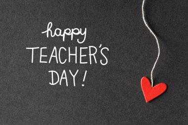 Happy Teachers Day message with paper hearts  clipart