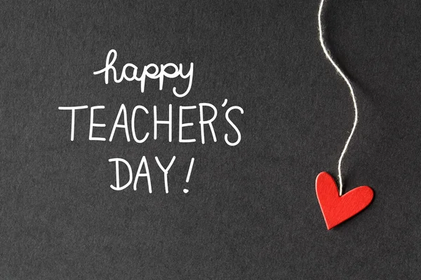 Happy Teachers Day message with paper hearts — Stock Photo, Image