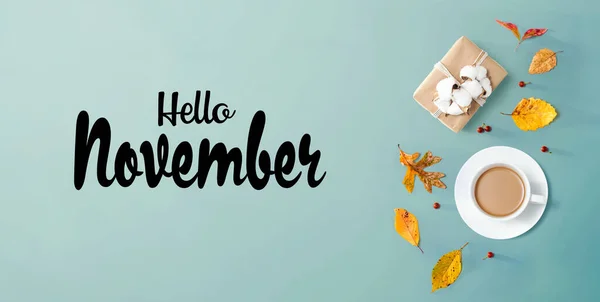 Hello November message with autumn theme with coffee
