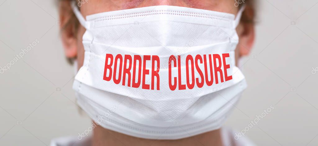 Border Closure Theme with person wearing a protective face mask