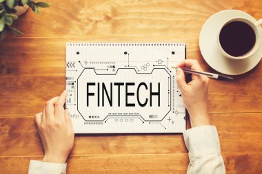 Not defterine yazı yazan kişinin Fintech konsepti
