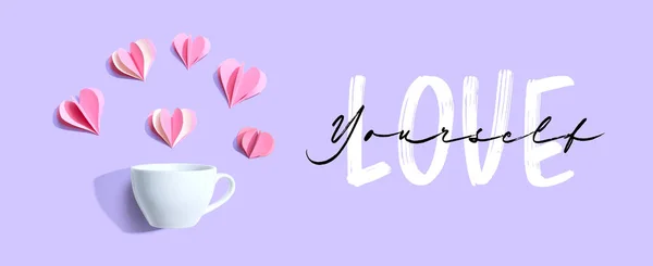 Love Yourself boodschap met een kopje koffie en papieren harten — Stockfoto