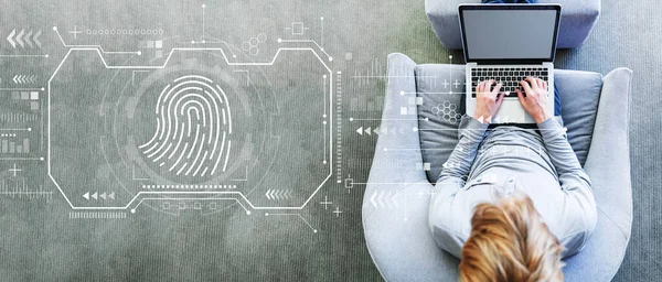 Fingerprint scanning theme with man using a laptop — Stock Photo, Image