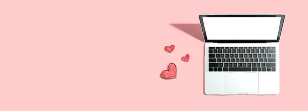 Laptop computer with craft heart drawings — Stock Photo, Image