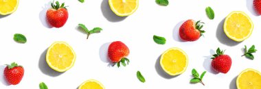 Fresh lemons and strawberries with mints clipart