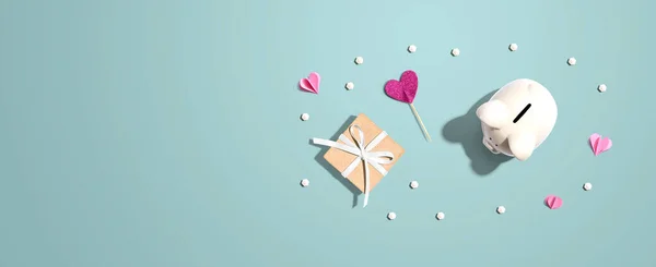 Sparschwein mit Geschenkbox und Herzen — Stockfoto