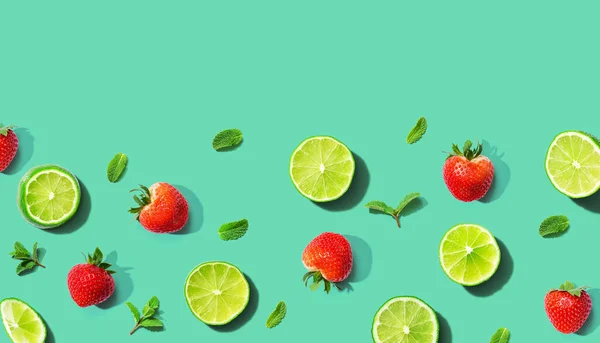 Fresh limes and strawberries with mints — Stock Photo, Image
