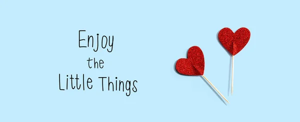 Enjoy the little things message with red glitter heart picks — Stock Photo, Image