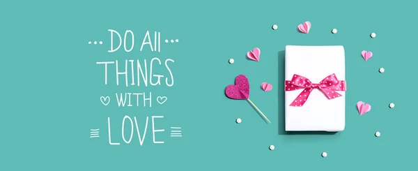 Do all things with love message with a gift box and hearts — Stock Photo, Image