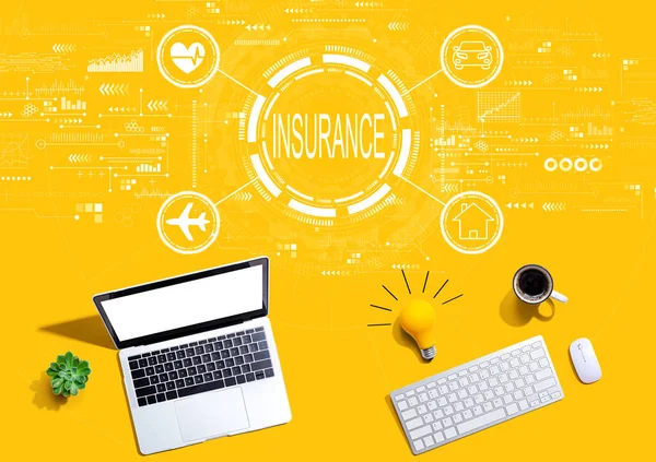 Insurance concept with computers with a light bulb — Stock Photo, Image