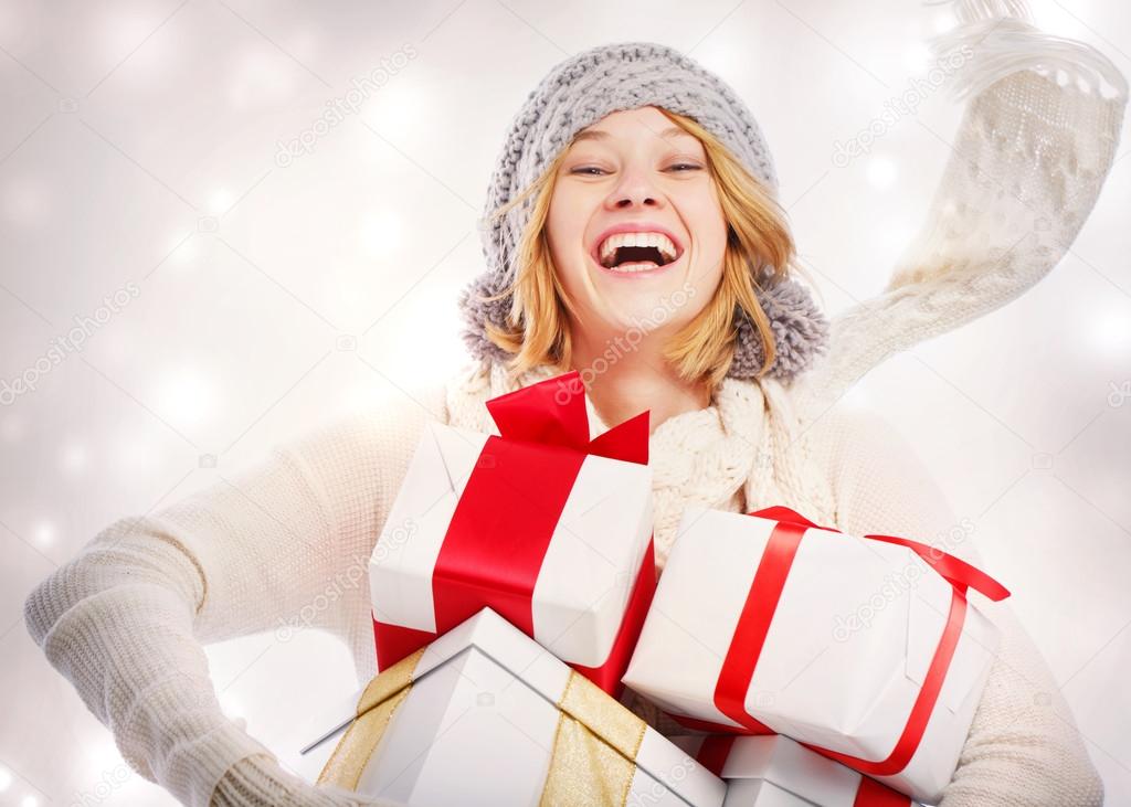 Happy Young Woman with Christmas Gifts