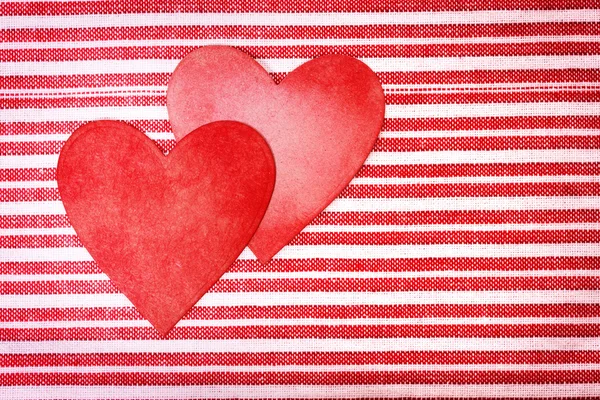 Two handcrafted paper hearts on striped background — Stock Photo, Image