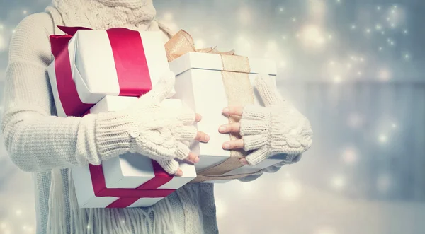 Woman holding many present boxes — Stock Photo, Image