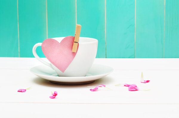 Coffee cup with heart tag