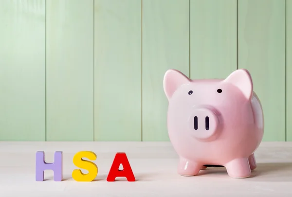 HSA theme withblock letters and a piggy bank — Stock Photo, Image