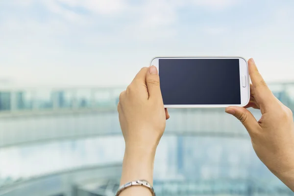 Person holding a cell phone — Stock Photo, Image