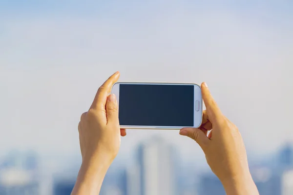 Person holding a smartphone — Stock Photo, Image