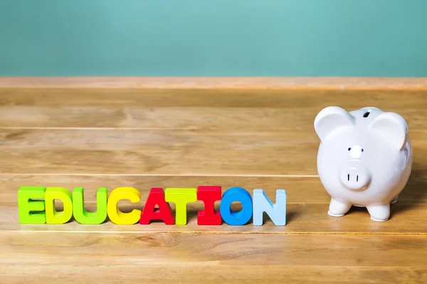 Education theme with piggy bank — Stock Photo, Image