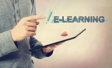 man pointing at E-Leaning text over tablet computer clipart