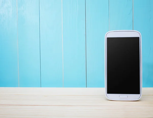 Smart phone on wooden background — Stock Photo, Image