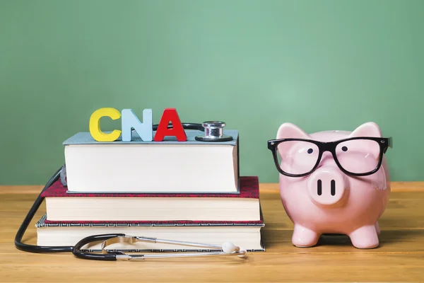 Certified Nursing Assistant CNA theme with pink piggy bank — Stock Photo, Image