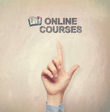 Hand pointing to Online Courses concepts clipart