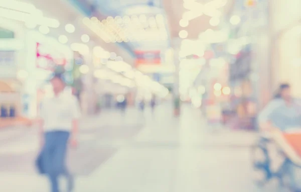 Blurred shopping mall with people walking in vintage style — Stock Photo, Image