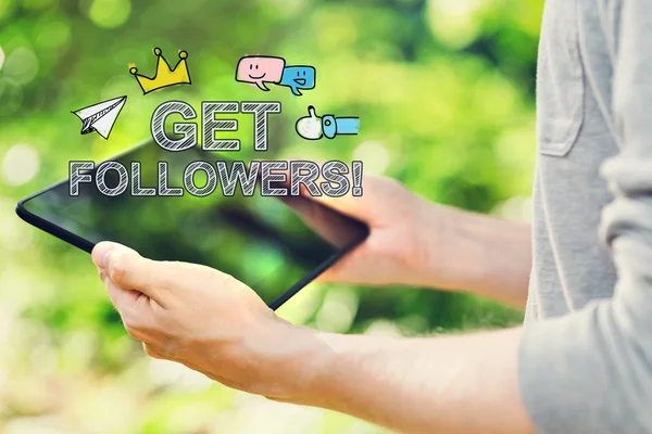 Get Followers concept with man holding his tablet computer — Stock Photo, Image