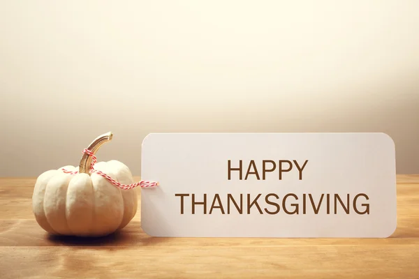 Happy Thanksgiving message with a white pumpkin — Stock Photo, Image