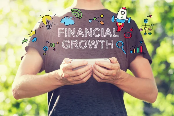 Finanční růst koncept se muž, který držel svůj smartphone — Stock fotografie