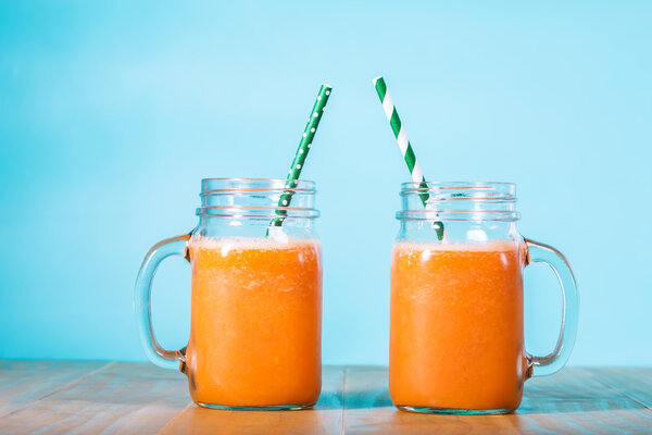 Carrot juice in masons jars
