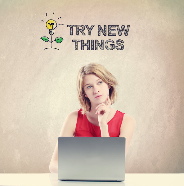 Try New Things concept with woman working on a laptop