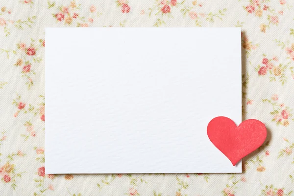 White blank paper card with floral fabric — Stock Photo, Image