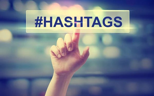 Hashtags concept with hand pressing a button — Stock Photo, Image