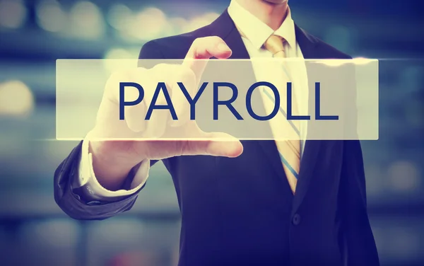 Business man holding Payroll — Stock Photo, Image