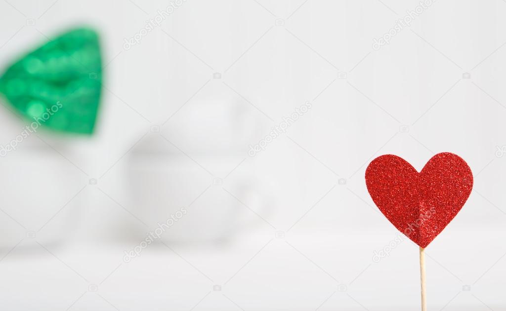 Small red heart with white dishes
