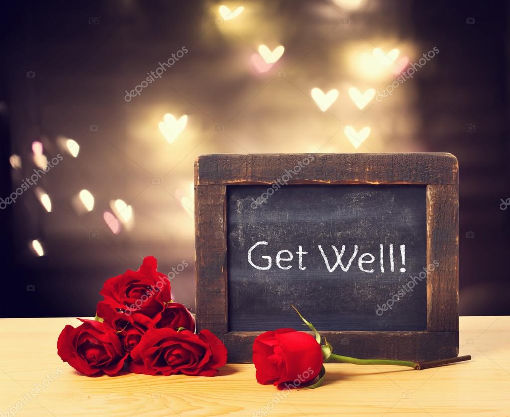 Get well message on a small chalkboard with red rose