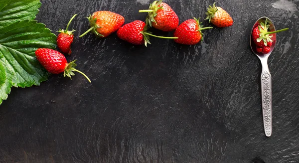 menu concept with slate background and strawberries
