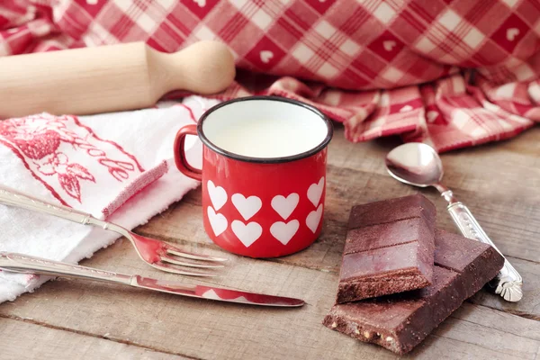 hearts decorated mug with milk and Modica chocolate