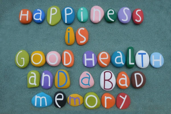 Happiness is good health and a bad memory, lifestyle quote composed with multi colored stone letters, Ingrid Bergman, swedish actress