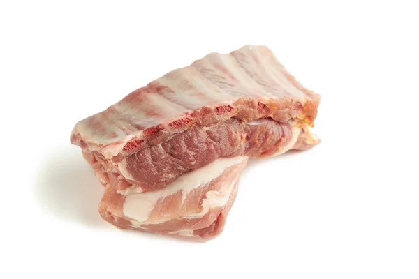 Fresh raw pork ribs isolated on a white background. two pieces. ingredient for meat cuisine. side view — Stock Photo, Image