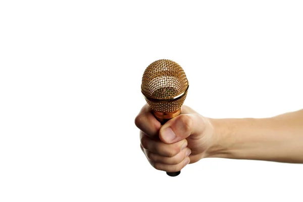 Micrófono dorado en mano aislado sobre un fondo blanco. espacio de copia. equipo de grabación de sonido. — Foto de Stock