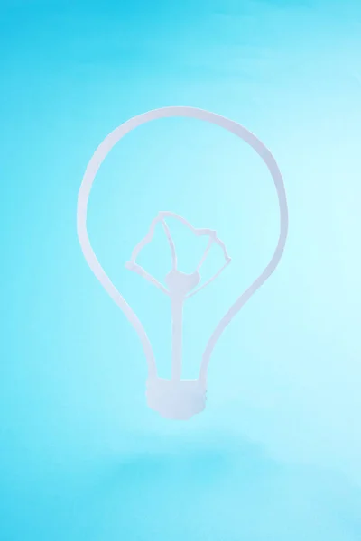 renewable energy industrial concept. light bulb symbol balancing over blue background. simple